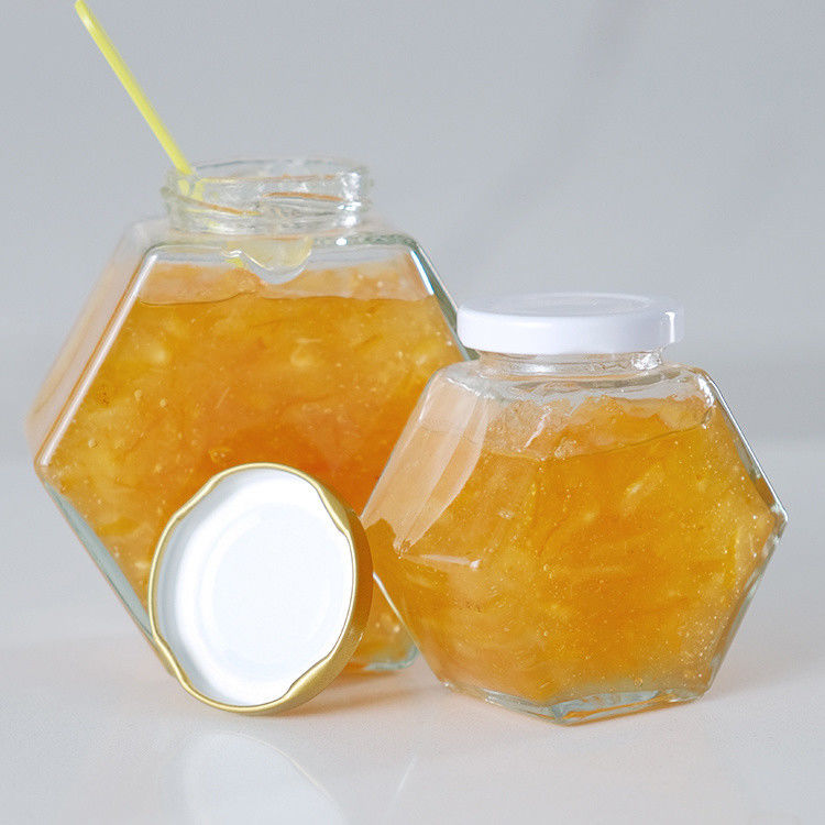 Hexagon Spessore di alimenti trasparenti in diverse dimensioni Bottine di miele di vetro con coperchi di metallo sigillati