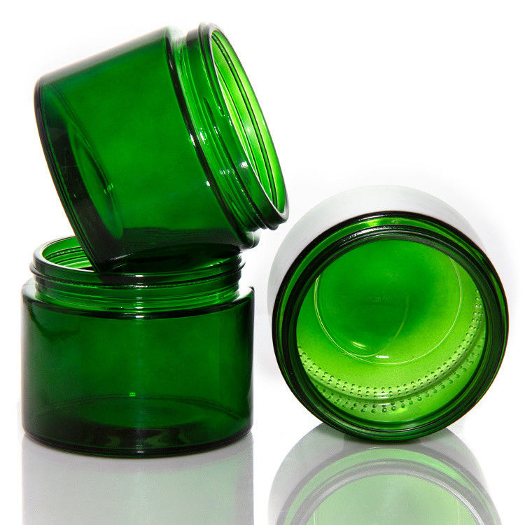 Vaso di candele di vetro trasparente di colore verde vuoto con coperchio