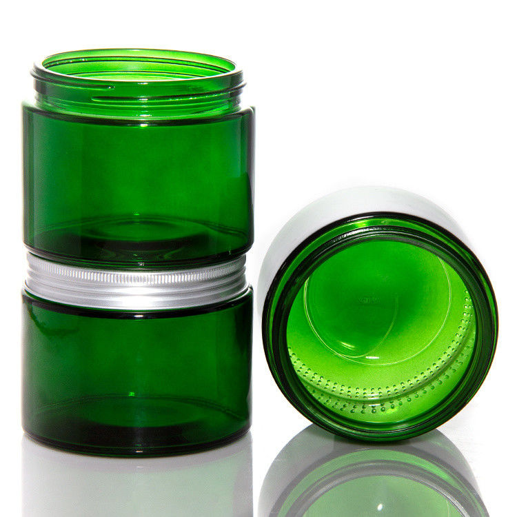 Vaso di candele di vetro trasparente di colore verde vuoto con coperchio