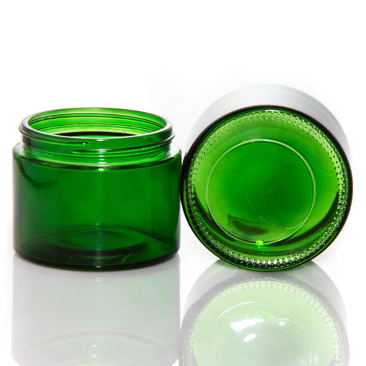 Vaso di candele di vetro trasparente di colore verde vuoto con coperchio