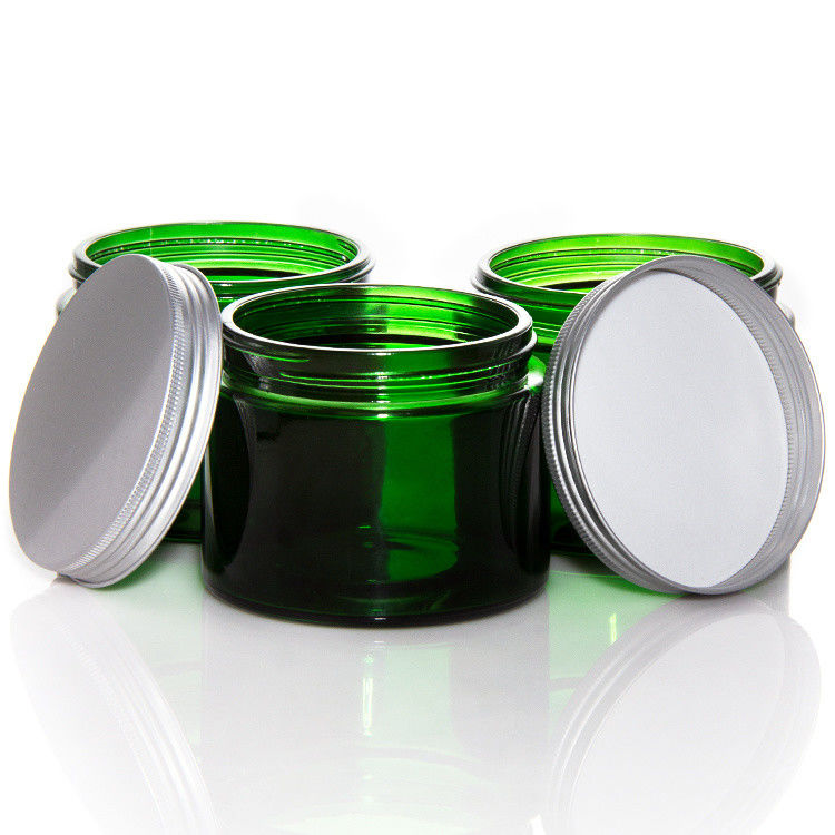 Vaso di candele di vetro trasparente di colore verde vuoto con coperchio