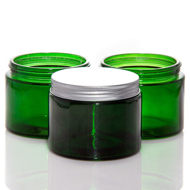 Vaso di candele di vetro trasparente di colore verde vuoto con coperchio