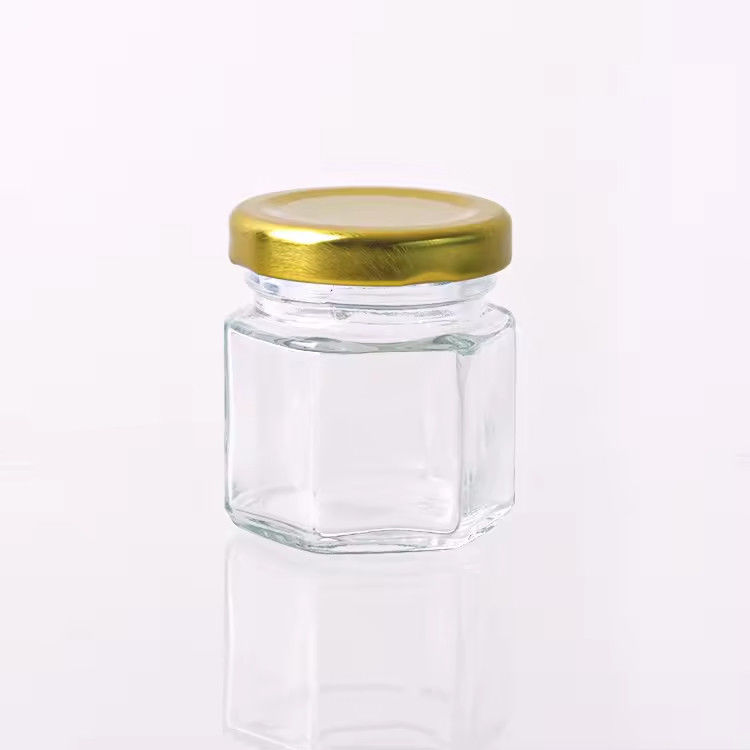 Etichetta personalizzata Forma esagonale 100ml 180ml 380ml Vaso in vetro di miele per marmellata di frutta d'oliva