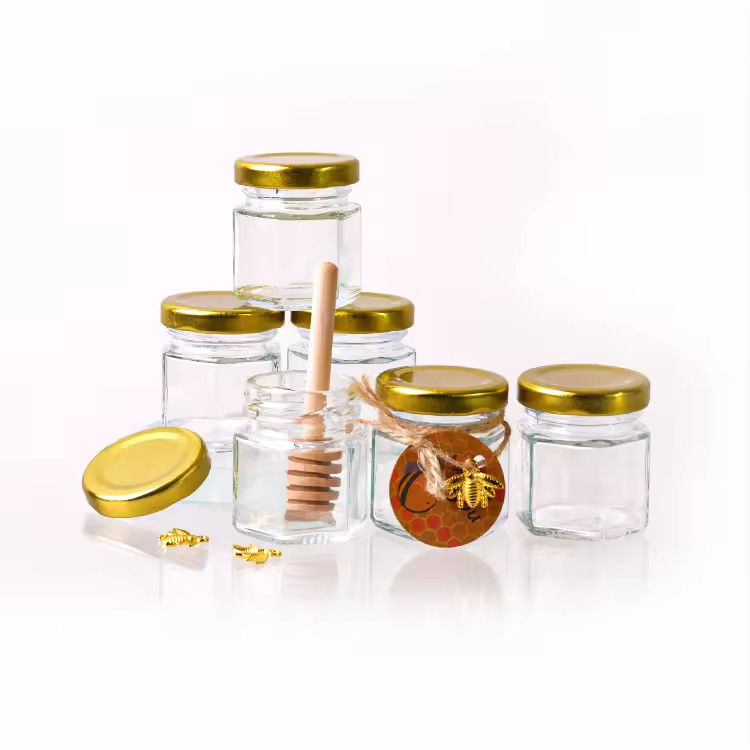 Etichetta personalizzata Forma esagonale 100ml 180ml 380ml Vaso in vetro di miele per marmellata di frutta d'oliva