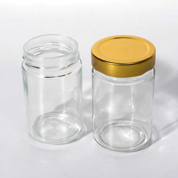 Utilizzare in fabbrica di alimenti 1 oz 4 oz 8 oz di forma rotonda contenitore di stoccaggio vuoto trasparente vetro gelatina marmellata vaso di salsa di miele