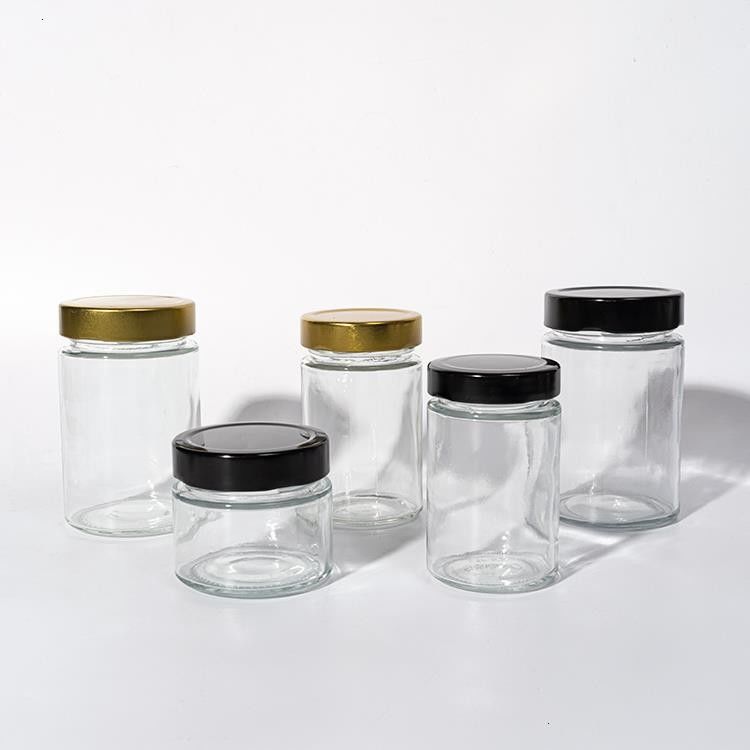 Utilizzare in fabbrica di alimenti 1 oz 4 oz 8 oz di forma rotonda contenitore di stoccaggio vuoto trasparente vetro gelatina marmellata vaso di salsa di miele
