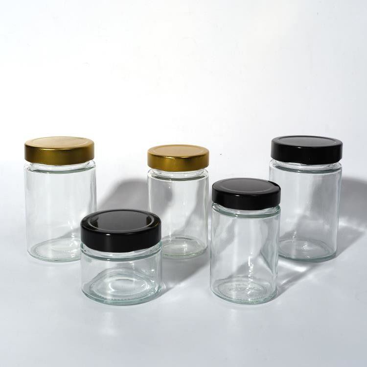 Utilizzare in fabbrica di alimenti 1 oz 4 oz 8 oz di forma rotonda contenitore di stoccaggio vuoto trasparente vetro gelatina marmellata vaso di salsa di miele