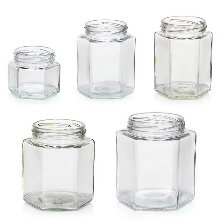 Bottine di miele di alta qualità 2 oz 3 oz trasparenti rotonde trasparenti di vetro per miele con coperchi colorati