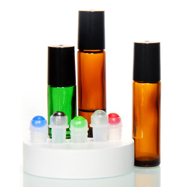 Perfume di vetro in rotolo su bottiglia con palla di acciaio inossidabile