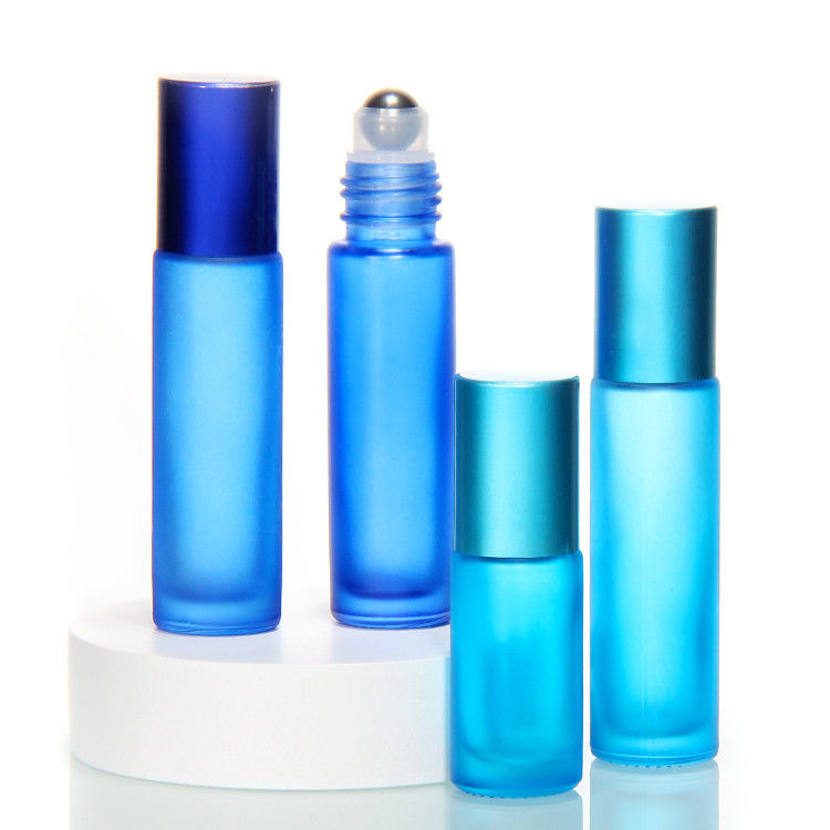 Perfume di vetro in rotolo su bottiglia con palla di acciaio inossidabile